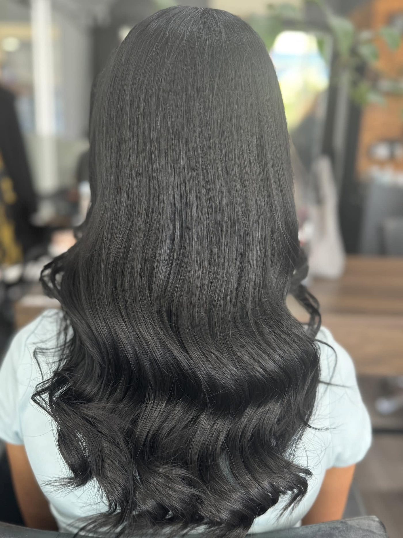 Glossy brunette curls result at Hair Pacific